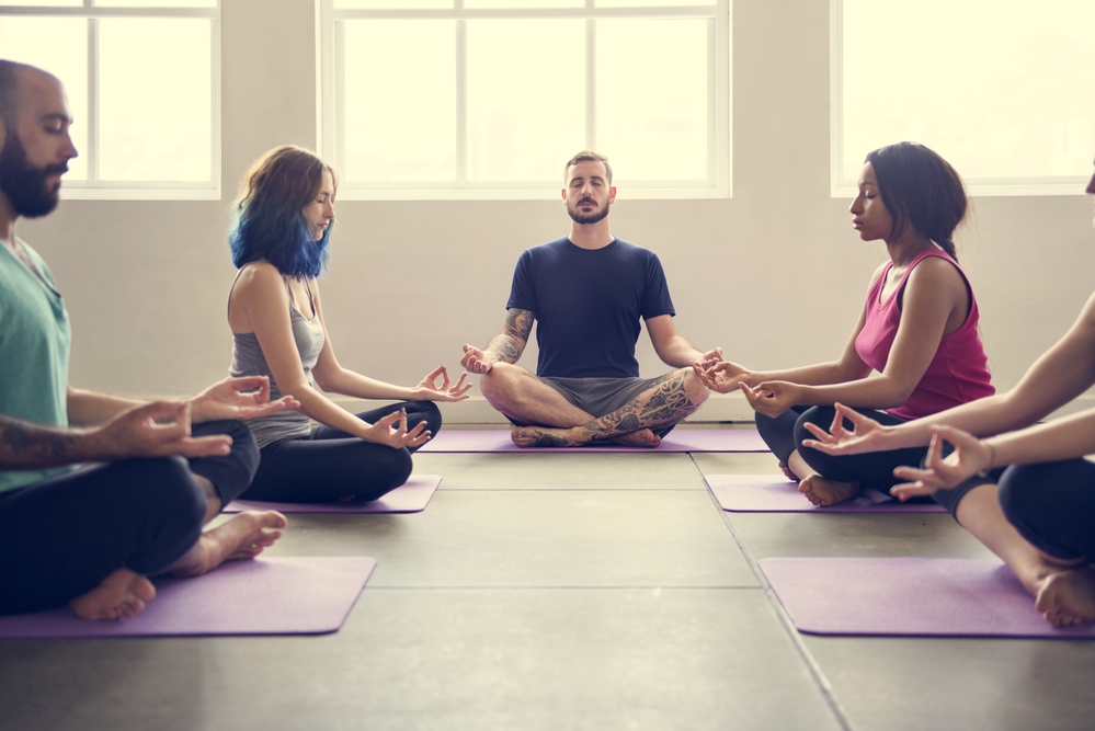 People doing yoga meditation